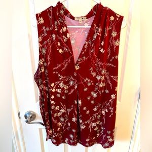 Burgundy sleeveless blouse with cute floral detail
